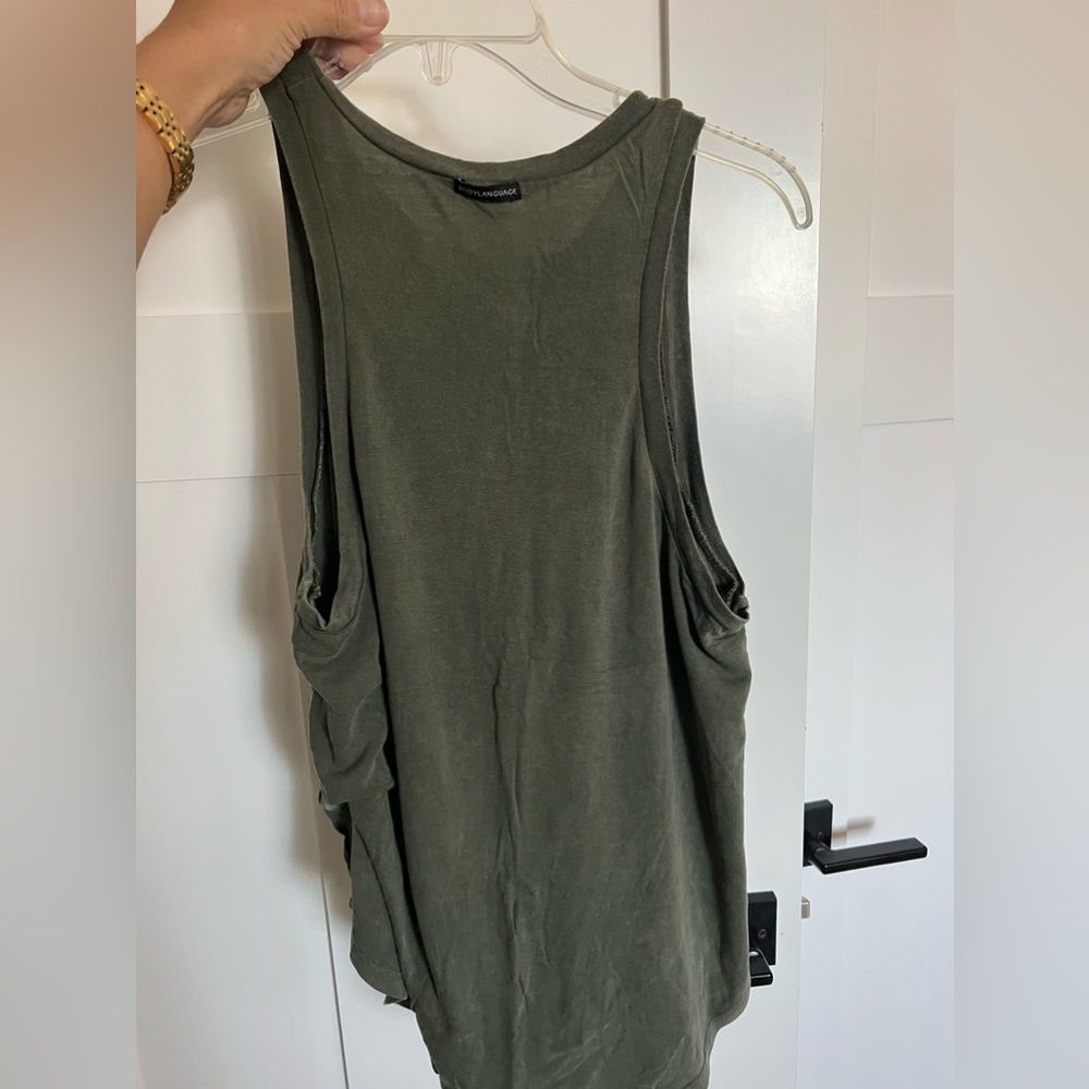 Body language, AKT racerback tank, olive green, size medium.